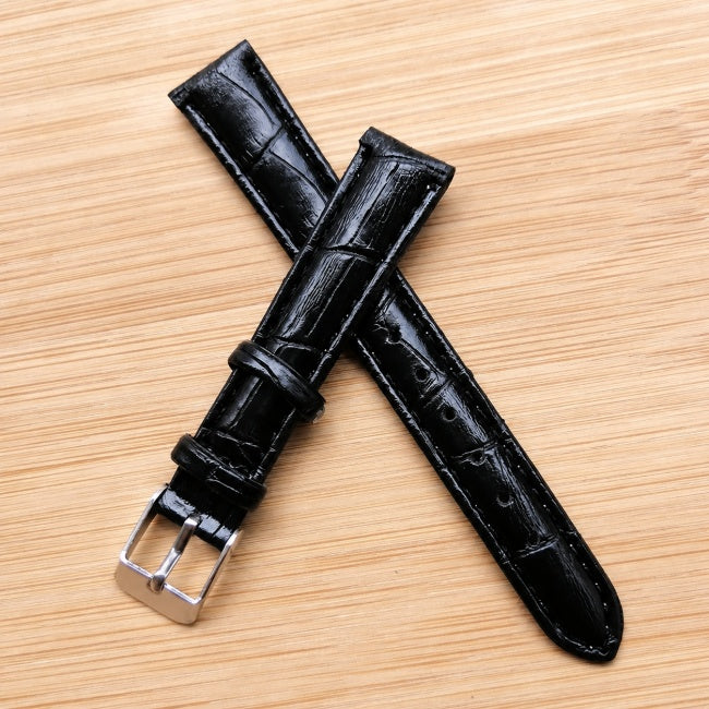 Black leather straps crossed and layered.